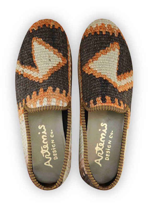Artemis Design & Co Men's Loafers in the stunning color combination of brown, orange, white, and peach are a must-have addition to any fashion-forward man's wardrobe. These loafers offer a harmonious blend of style and comfort, making them perfect for both formal and casual occasions.  (Front View)