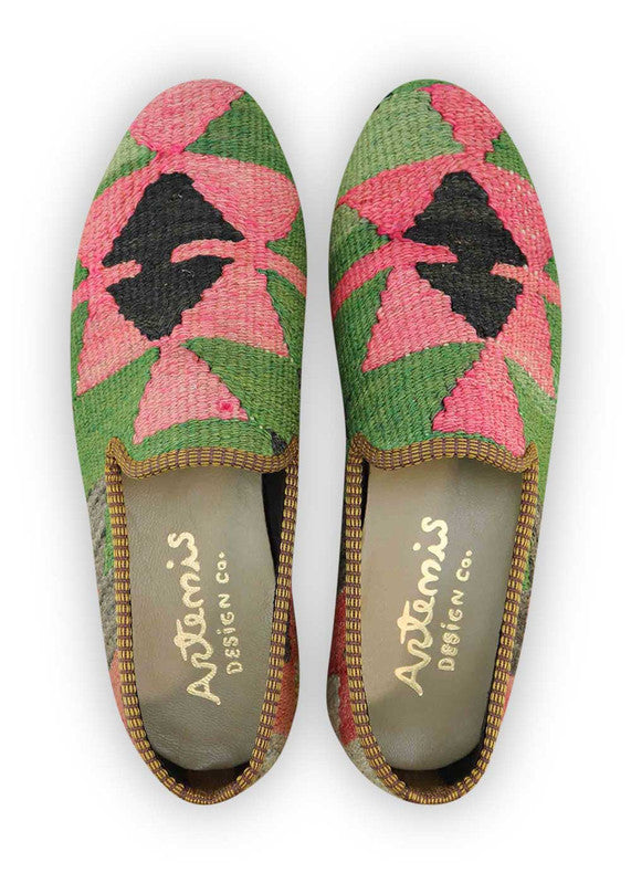 The Artemis Men's Loafers embrace a vibrant mix of colors, featuring green, pink, black, red, and grey. These loafers artfully combine the freshness of green and pink with the classic appeal of black and red, balanced by the neutral tones of grey. (Front View)