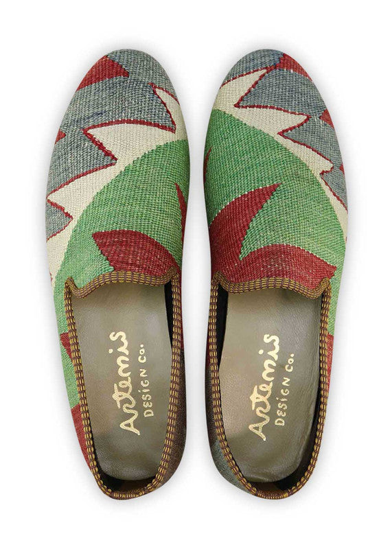 The Artemis Men's Loafers showcase a tasteful interplay of colors, featuring shades of grey, dark grey, maroon, green, and white. These loafers elegantly blend the versatility of grey and dark grey with the richness of maroon and the freshness of green, all against a clean white backdrop. (Front View)