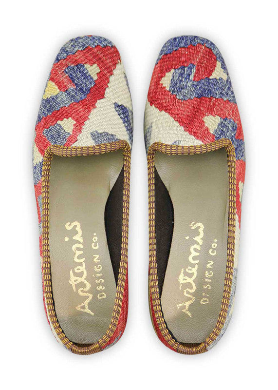 Artemis Design & Co Women's Loafers embrace a vibrant color palette with hues of blue, red, white, and green. Meticulously crafted, these loafers seamlessly blend bold and fresh tones, creating a stylish and versatile footwear option. (Front View)