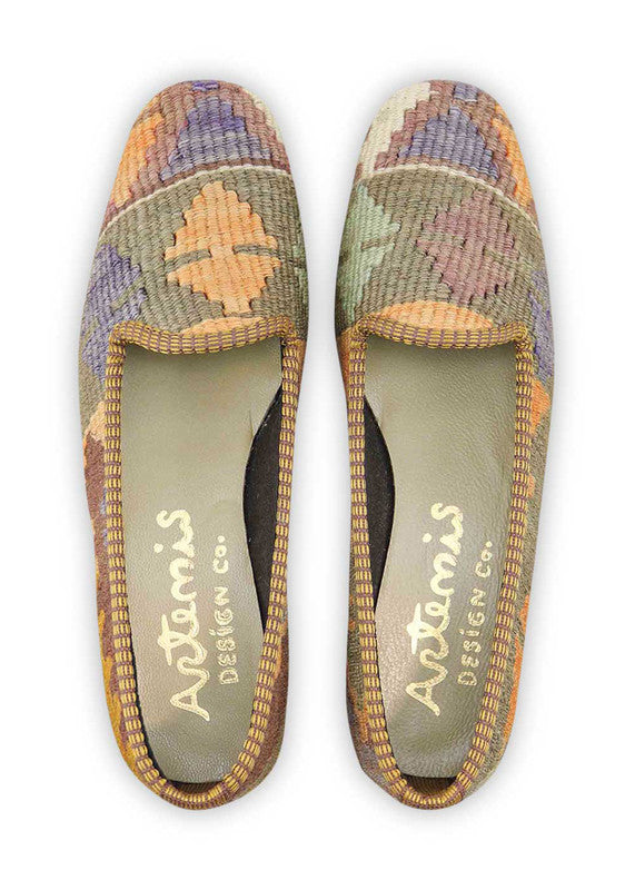 Artemis Design & Co Women's Loafers epitomize understated elegance with a refined color palette of white, brown, grey, orange, and yellow. Meticulously crafted, these loafers seamlessly blend neutral tones with pops of warmth, creating a versatile and stylish footwear option. (Front View)