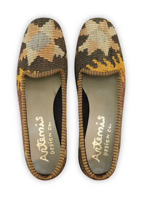 Artemis Design Co. Women's Loafers exude timeless elegance with a refined color palette of black, white, peach, mustard, and maroon. Meticulously crafted, these loafers seamlessly blend classic and warm tones, creating a versatile and stylish footwear option. The dynamic interplay of colors, from the crisp black and white to the soft peaches and mustards, complemented by the rich maroon, adds a touch of modern flair. (Front View)