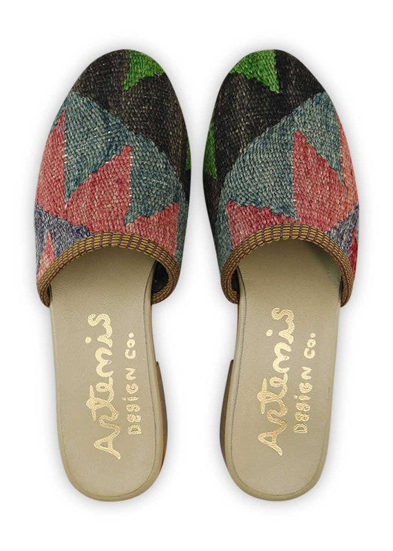 Artemis Design & Co Women's Slides are a chic and fashionable choice for women, featuring a stunning color combination of green, red, black, and grey. These slides are designed with utmost attention to detail and crafted using high-quality materials, ensuring both style and comfort. (Front View)