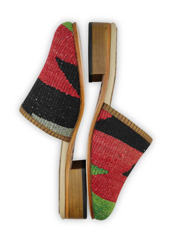 Artemis Design & Co Women's Slides are a chic and fashionable choice for women, featuring a stunning color combination of green, red, black, and grey. These slides are designed with utmost attention to detail and crafted using high-quality materials, ensuring both style and comfort. (Side View)