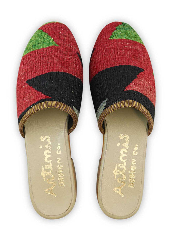 Artemis Design & Co Women's Slides are a chic and fashionable choice for women, featuring a stunning color combination of green, red, black, and grey. These slides are designed with utmost attention to detail and crafted using high-quality materials, ensuring both style and comfort. (Front View)