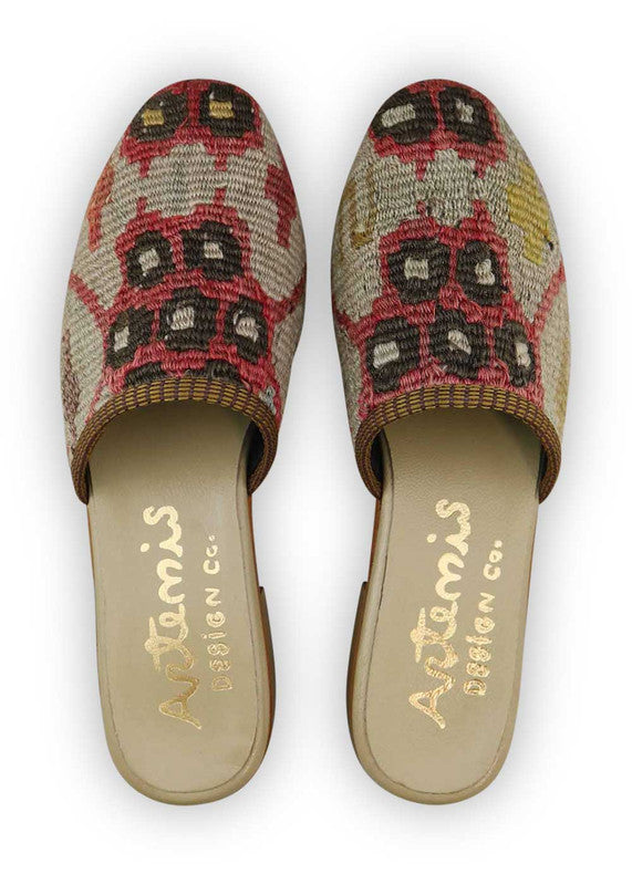 The Artemis Women's Slides feature a delightful color combination of red, beige, khaki, and brown. These slides present a harmonious blend of warm and neutral tones, creating a versatile and stylish look. (Front View)