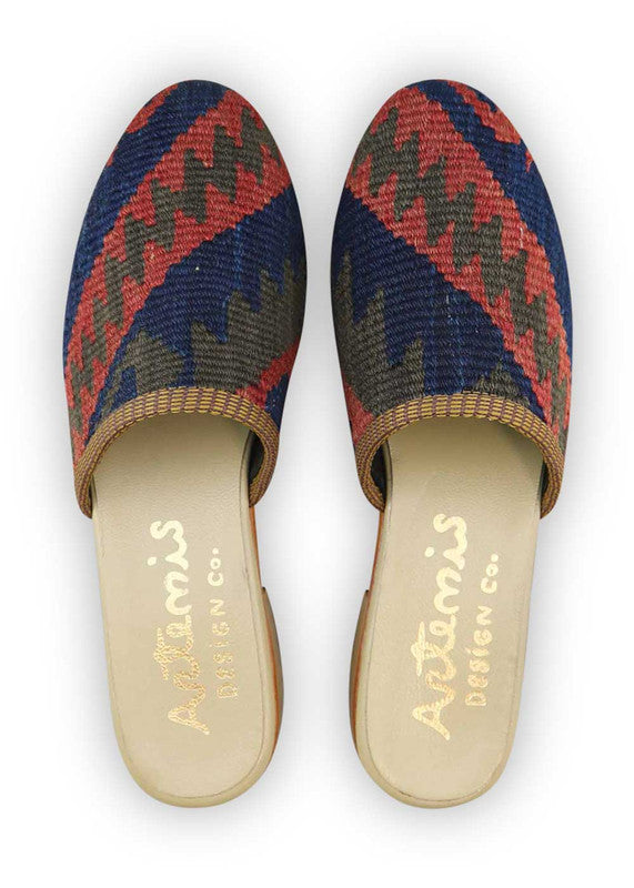 The Artemis Women's Slides exhibit a charming color combination of red, brown, and blue. These slides offer a tasteful blend of warm and cool tones, creating a versatile and stylish look. Whether you're enjoying a leisurely day or heading out for a casual outing, these slides are the perfect choice. (Front View)