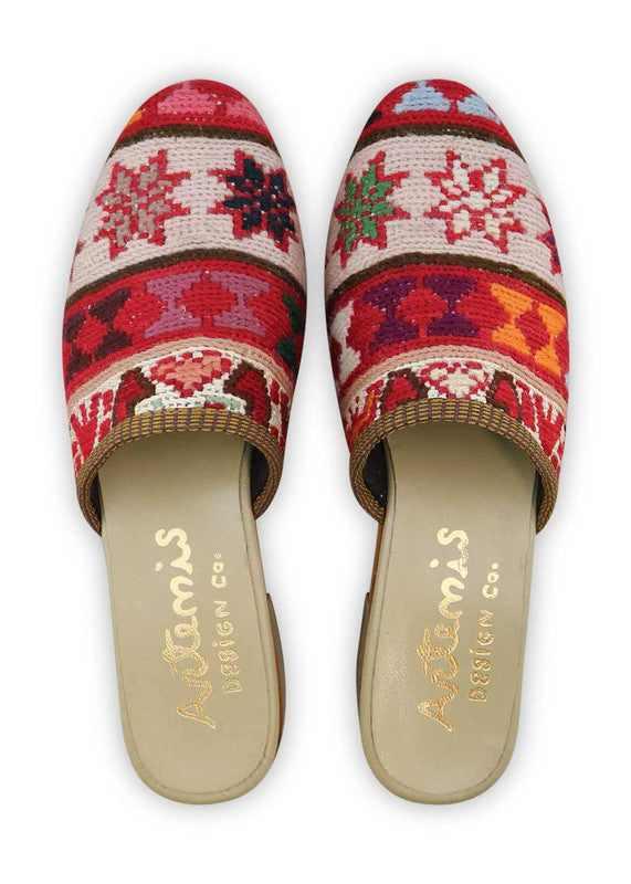 The Artemis Women's Slides showcase a lively color combination of red, white, green, teal, pink, peach, brown, and khaki. These slides offer a vibrant blend of bold and soft tones, creating a playful and stylish look. Whether you're unwinding by the pool or heading out for a casual outing, these slides are the perfect choice. (Front View)