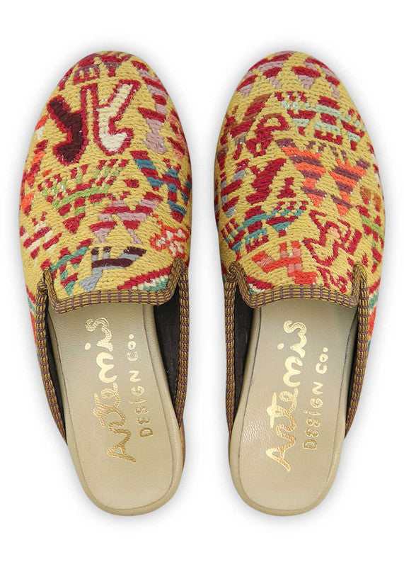 Artemis Design& Co Women's Slippers in the vibrant color combination of red orange, yellow, sky blue, white, purple, and orange are a stylish and comfortable choice for women. Crafted with high-quality materials and meticulous attention to detail, these slippers offer durability and long-lasting comfort. (Front View)