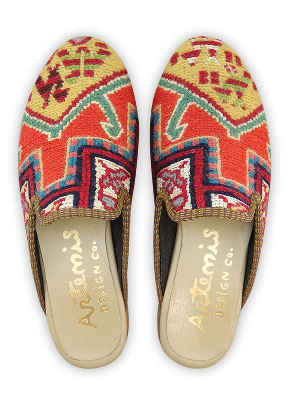 The Artemis Design& Co Women's Slippers are a stylish and versatile choice for any woman. These slippers feature a unique color combination of red, black, blue, mustard, green, and teal. Crafted with high-quality materials and attention to detail, these slippers offer durability and long-lasting comfort.  (Front View)