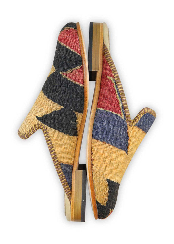The Artemis Design& Co Women's Slippers in the color combination of red, black, blue, and mustard are a fashionable and comfortable choice for women. These slippers are crafted with high-quality materials and attention to detail, ensuring durability and long-lasting comfort. (Side View)