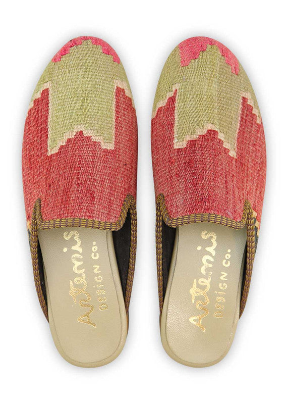 Artemis Design& Co Women's Slippers in red, khaki, white, and black are the epitome of style and comfort. Crafted with high-quality materials and attention to detail, these slippers offer durability and a luxurious feel. The color combination of red, khaki, white, and black adds a bold and sophisticated touch to any outfit.  (Front View)