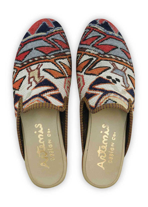 The Artemis Men's Slippers feature a sophisticated color combination of red, white, brown, grey, orange, and black. These slippers offer a harmonious blend of bold and neutral tones, creating a stylish and versatile look. Whether you're unwinding at home or stepping out for a casual outing, these slippers are the perfect choice. (Front View)