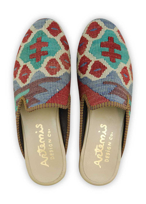 The Artemis Men's Slippers showcase a dynamic color combination of blue, white, red, black, and teal. These slippers offer a vibrant mix of bold and neutral tones, creating a stylish and eye-catching look. Whether you're unwinding at home or stepping out for a casual outing, these slippers are the perfect choice. (Front View)