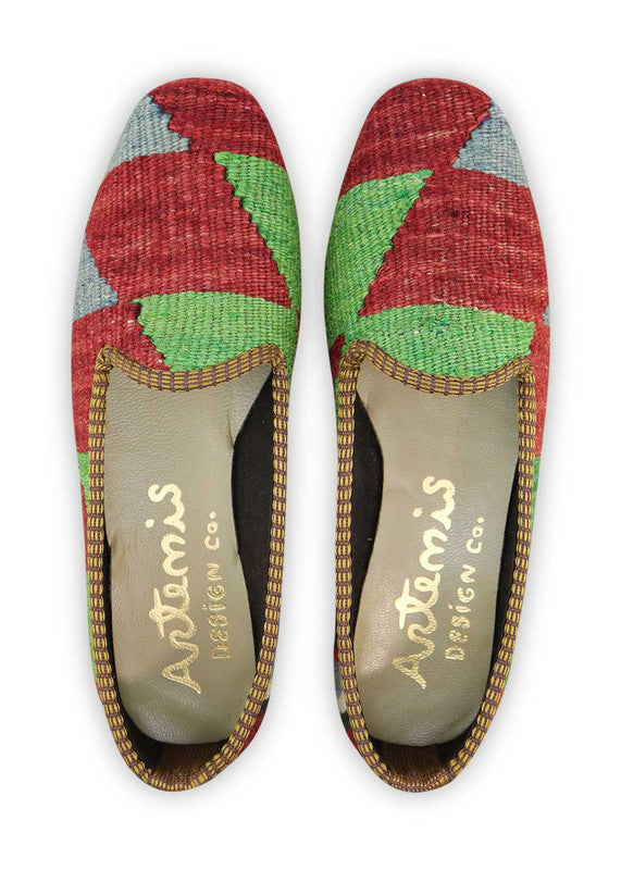 The Artemis Women's Loafer features a bold and versatile color combination of red, green, black, white, and blue. These loafers offer a captivating mix of vibrant and neutral tones, making them a perfect accessory to elevate any outfit. Whether you're going for a casual day out or dressing up for a special occasion, these loafers add a touch of style and sophistication to your ensemble. (Front View)