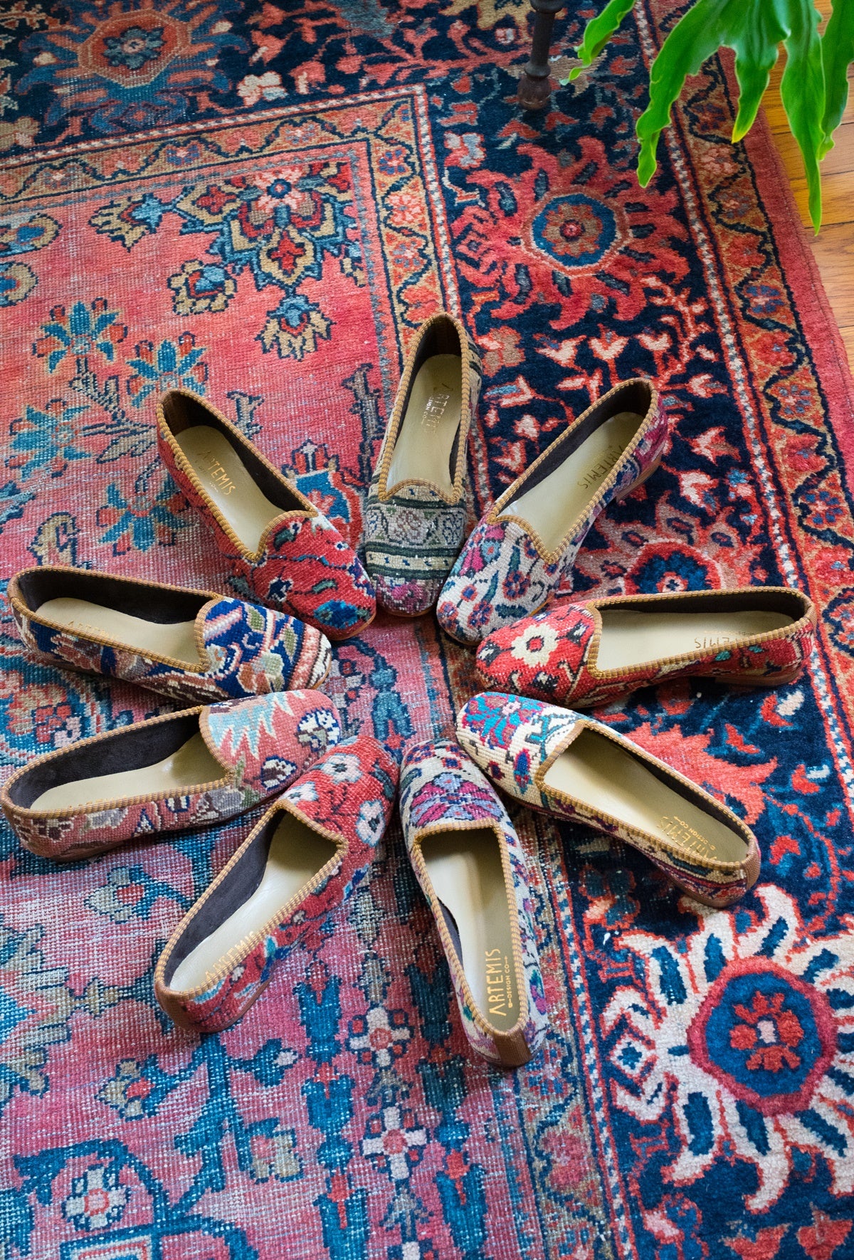circle of women's carpet loafers on an oriental carpet