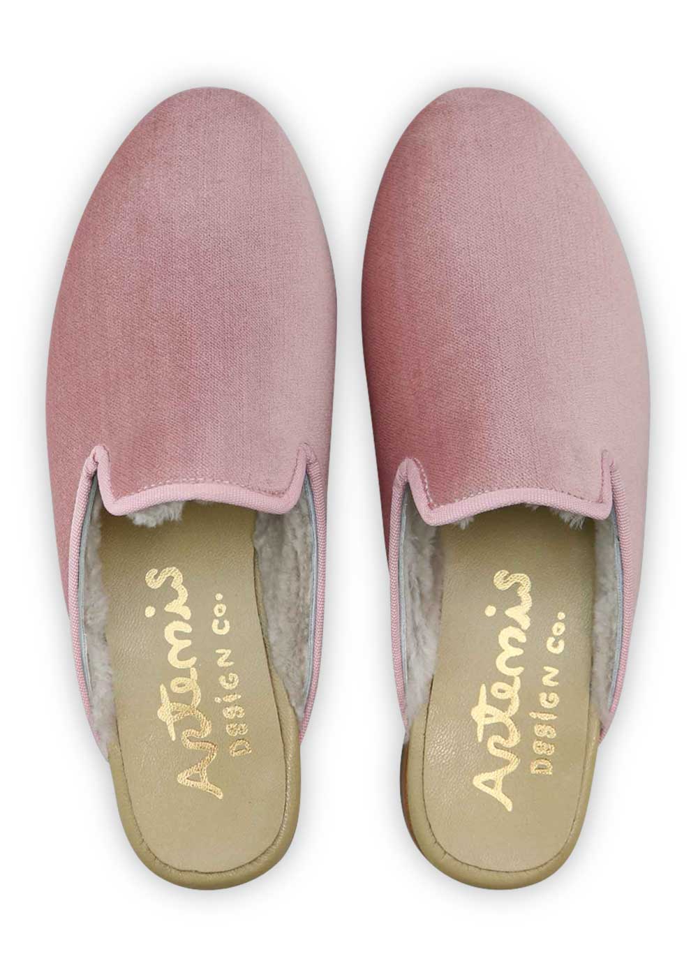 Artemis Design Co Women's Shearling-Lined Velvet Slippers in a delightful shade of pink bring a touch of luxury and femininity to your loungewear collection. These stylish slippers showcase a plush shearling lining for ultimate comfort and warmth. The soft velvet exterior adds a chic and glamorous element to your relaxation routine. ( Front View)