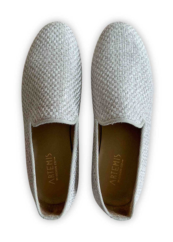 Introducing Artemis Design Co Men's Loafers in a sleek shade of grey. Crafted with meticulous attention to detail, these loafers offer a perfect balance of style and comfort. Versatile and sophisticated, they effortlessly complement a variety of outfits, making them ideal for both casual and formal occasions. Step into refined elegance with Artemis Design Co Men's Loafers in timeless grey. (Front View)