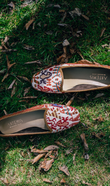 Kilim shoes on grass with leaves