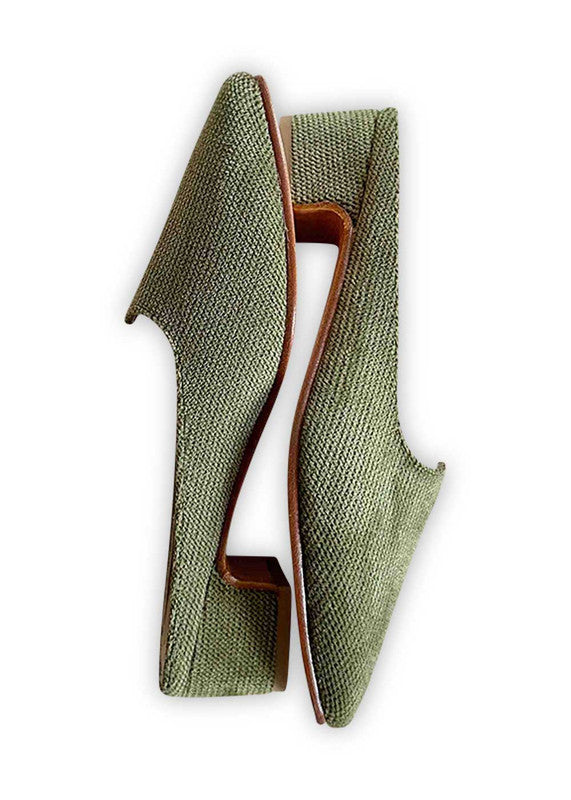  Introducing Artemis Design Co Women's Mules in a captivating shade of green. These stylish mules effortlessly fuse elegance with comfort, making them the perfect choice for any occasion. Crafted with meticulous attention to detail, they boast a timeless design that complements a variety of outfits. Step into sophistication and elevate your ensemble with Artemis Design Co Women's Mules in this refreshing green hue. (Side View)