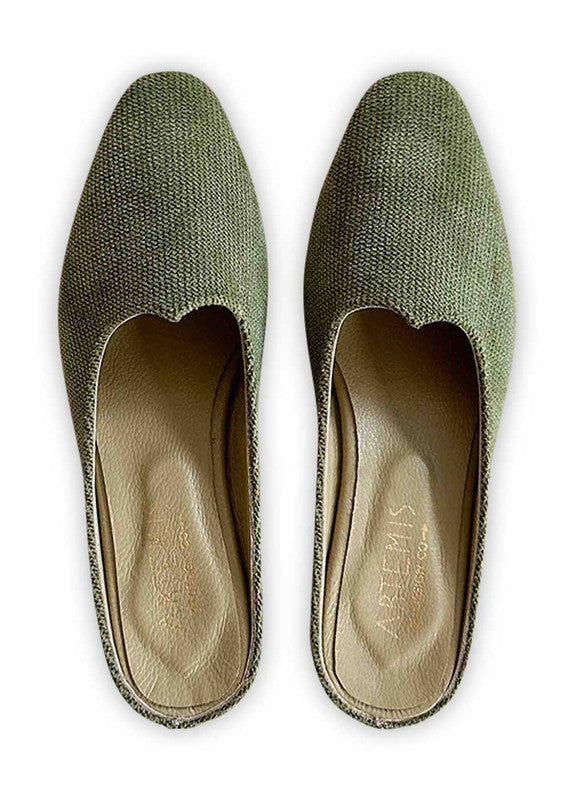  Introducing Artemis Design Co Women's Mules in a captivating shade of green. These stylish mules effortlessly fuse elegance with comfort, making them the perfect choice for any occasion. Crafted with meticulous attention to detail, they boast a timeless design that complements a variety of outfits. Step into sophistication and elevate your ensemble with Artemis Design Co Women's Mules in this refreshing green hue. (Front View)