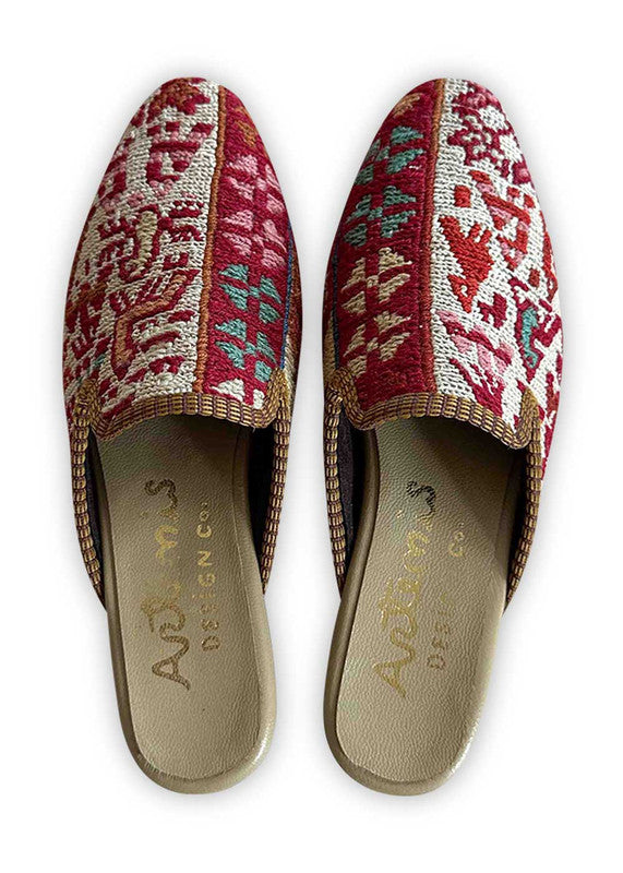 Elevate your style with Artemis Design Co Women's Mules, featuring a captivating color palette of red, khaki, pink, blue, black, brown, white, and green. These mules blend vibrant hues seamlessly for a chic and versatile look. Whether you're dressing up for a night out or adding flair to your everyday ensemble, these meticulously crafted mules offer both comfort and sophistication. (Front View)