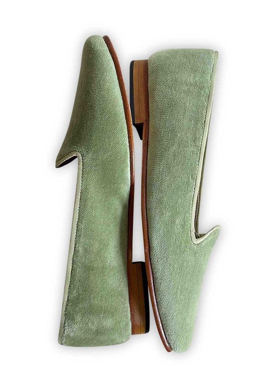 Artemis Design Co's Women's Loafers in green offer a fresh and vibrant take on classic footwear. Crafted with meticulous attention to detail, these loafers feature a sleek design with a comfortable fit. The rich green hue adds a pop of color to any outfit, making them perfect for both casual and formal occasions. (Side View)