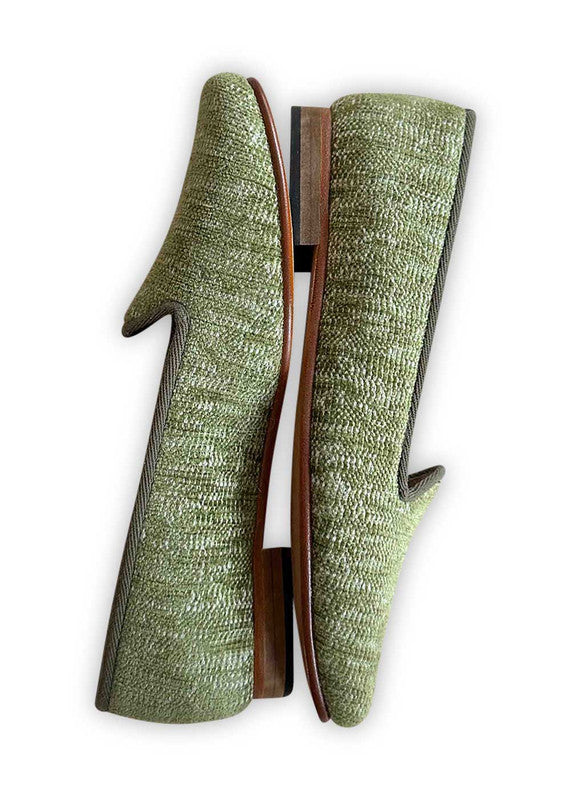 Artemis Design Co's Women's Loafers in green offer a fresh and vibrant take on classic footwear. Crafted with meticulous attention to detail, these loafers feature a sleek design with a comfortable fit. The rich green hue adds a pop of color to any outfit, making them perfect for both casual and formal occasions.  (Side View)