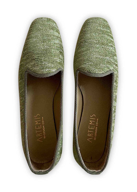 Artemis Design Co's Women's Loafers in green offer a fresh and vibrant take on classic footwear. Crafted with meticulous attention to detail, these loafers feature a sleek design with a comfortable fit. The rich green hue adds a pop of color to any outfit, making them perfect for both casual and formal occasions. (Front View)