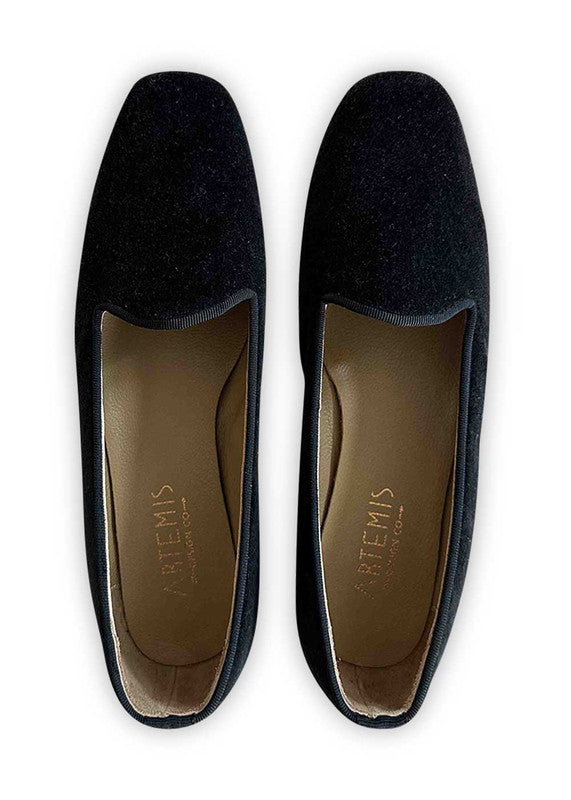 Artemis Design Co's Women's Suede Loafers in black offer a timeless blend of sophistication and comfort. Crafted with luxurious suede material, these loafers exude elegance and versatility. The sleek black hue adds a classic touch, making them suitable for various occasions, from casual outings to more formal events. With their refined silhouette and attention to detail, these loafers are a staple addition to any woman's wardrobe, providing style and comfort with every step. (Front View)