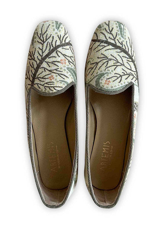 Artemis Design Co's Women's Loafers showcase a captivating color palette of peach, white, grey, and dark grey, blending elegance with versatility. These loafers are meticulously crafted, featuring a sleek design with a plush interior for comfort. The harmonious color combination of peach, white, grey, and dark grey creates a sophisticated aesthetic, suitable for both casual outings and more formal occasions. (Front View)