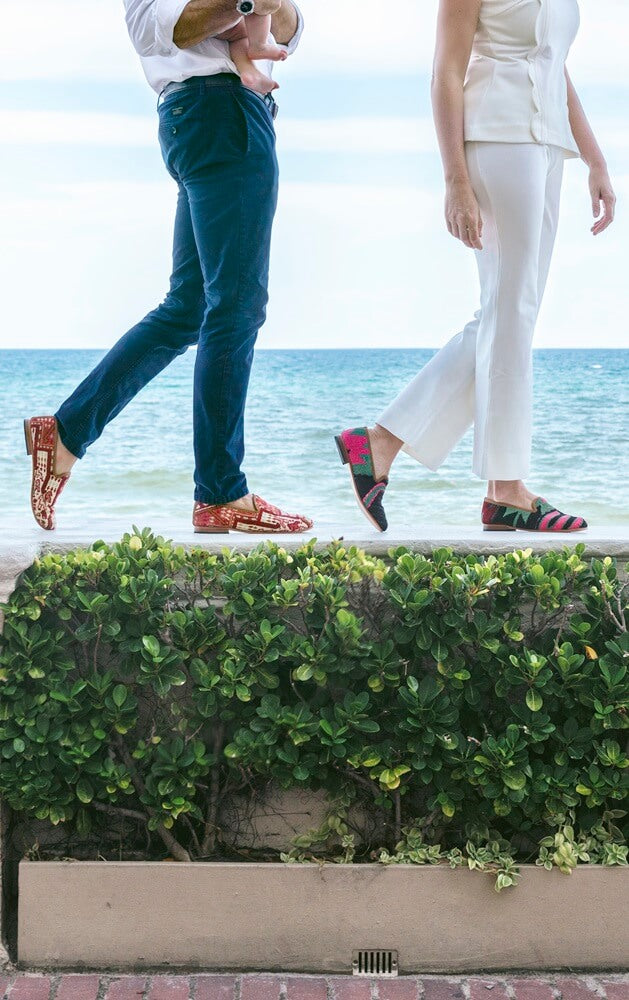 Couple walking on a wall and wearing kilim smoking shoes