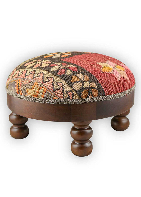 The Artemis Design & Co Footstool is a lively and stylish addition to your living space, featuring a dynamic color combination of red, pink, orange, brown, cream, and peach. Meticulously crafted, this footstool seamlessly blends warm and vibrant tones, creating a chic and eye-catching accent piece. (Side View)