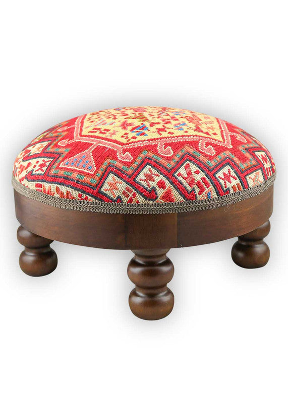 The Artemis Design & Co Footstool is a charming and versatile accent piece, showcasing a delightful color palette of red, white, cream, green, peach, blue, and brown. Meticulously crafted, this footstool seamlessly blends warm and cool tones, creating a stylish and functional addition to your living space.(Side View)