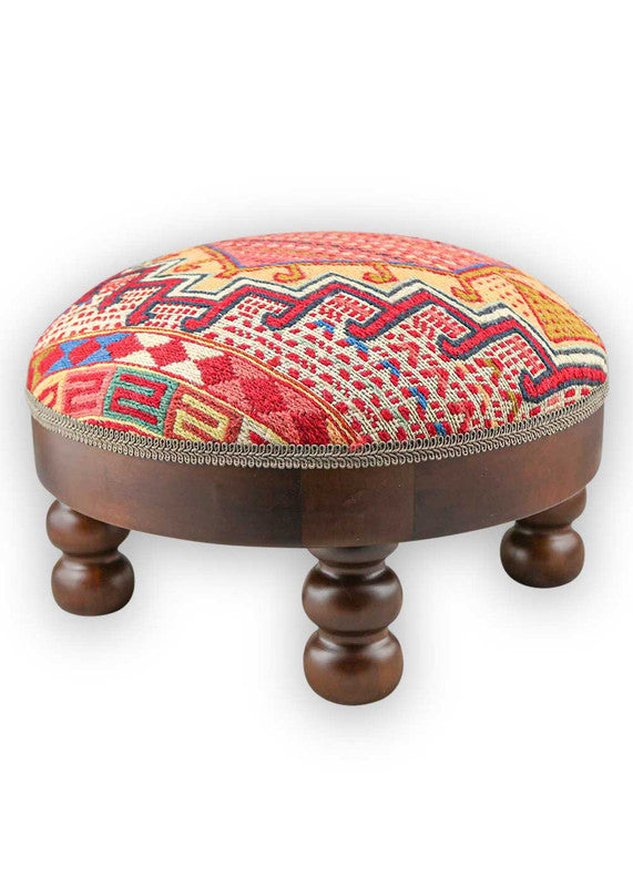 The Artemis Design & Co Footstool is a charming and versatile accent piece, showcasing a delightful color palette of red, white, cream, green, peach, blue, and brown. Meticulously crafted, this footstool seamlessly blends warm and cool tones, creating a stylish and functional addition to your living space. (Side View)