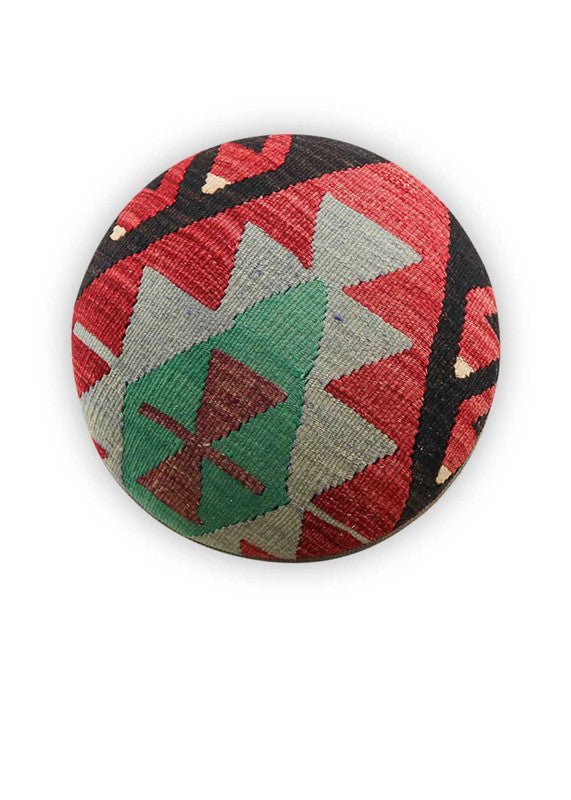 The Artemis Design & Co Foot Stool featuring a captivating color combination of black, red, green, white, red-orange, and grey is a bold and visually striking addition to any living space. This foot stool's eclectic mix of colors creates a vibrant and contemporary aesthetic that stands out in a room. (Front View)