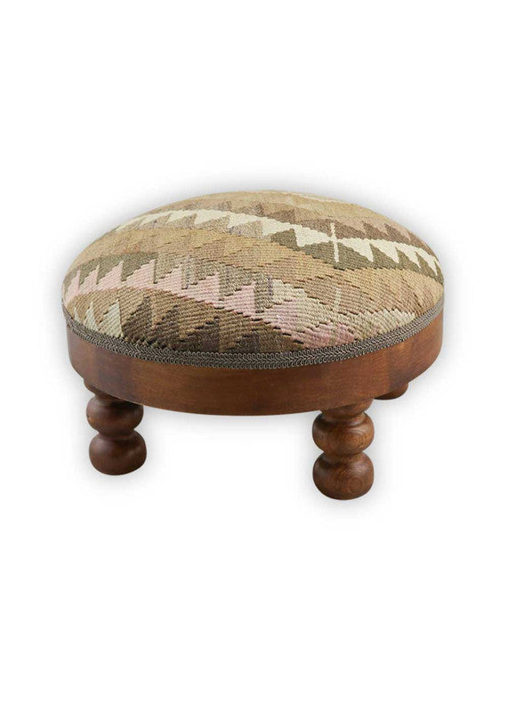 The Artemis Design & Co Foot Stool, showcasing a sophisticated color combination of brown, khaki, grey, and baby pink, is an elegant and charming addition to your home decor. This foot stool's muted and harmonious color palette exudes a sense of warmth and tranquility, making it a perfect fit for various living spaces.