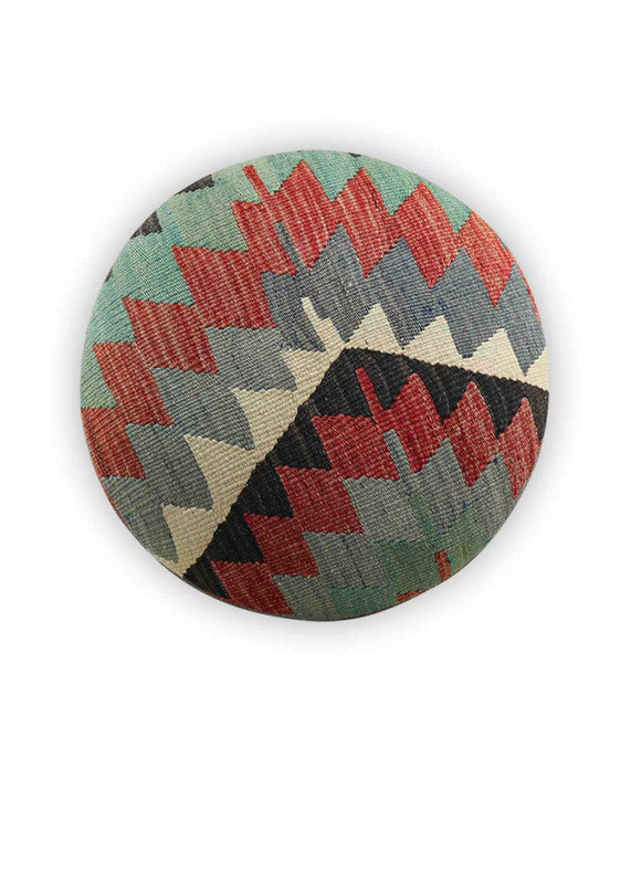 The Artemis Design & Co Foot Stool featuring a captivating color combination of black, red, green, white, red-orange, and grey is a bold and visually striking addition to any living space. This foot stool's eclectic mix of colors creates a vibrant and contemporary aesthetic that stands out in a room. (Front View)