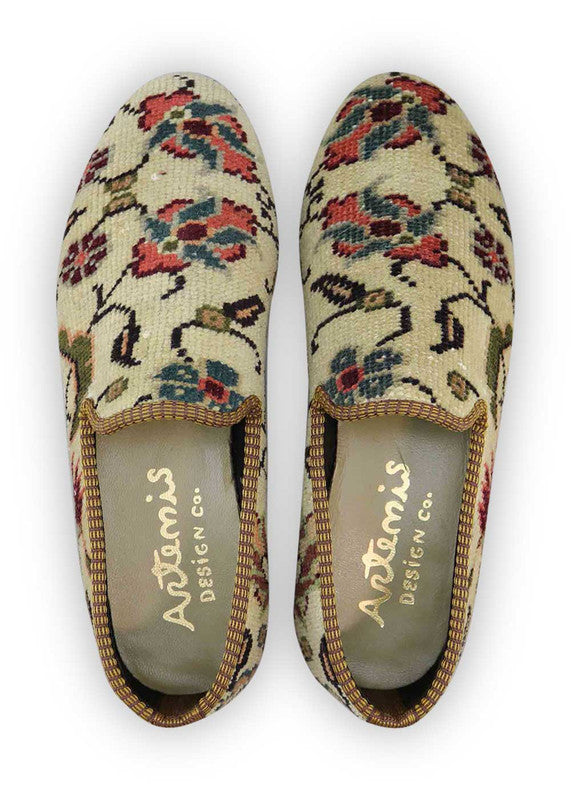 Artemis Design & Co Men's Loafers are a fashionable choice for men who want to add a touch of style to their outfit. These loafers feature a captivating color combination of off white, red, maroon, green, grey, and peach. Made with premium materials, these loafers offer both comfort and durability. (Front View)