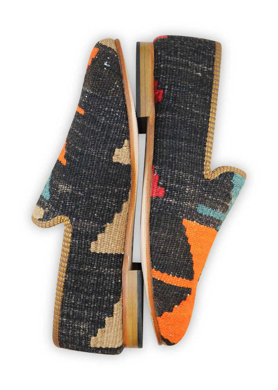 Artemis Design & Co Men's Loafers are the perfect blend of style and versatility. With a color combination of black, khaki, orange, and blue, these loafers offer a bold and eye-catching look. Crafted with premium materials, they provide unbeatable comfort and durability.  (Side View)