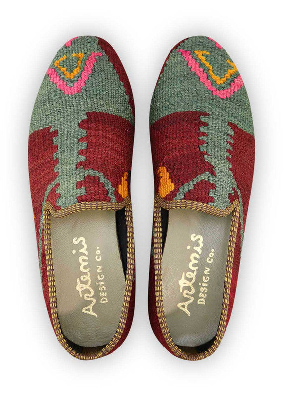 Artemis Design & Co Men's Loafers are a stylish and versatile choice for men, featuring a vibrant color combination of maroon, green, fuschia, yellow orange, black, and white. These loafers are crafted with premium materials, ensuring both comfort and durability. (Front View)