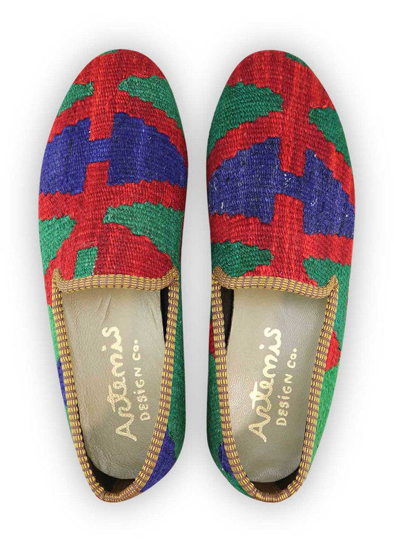 Artemis Design & Co Men's Loafers in red, green, and blue color combination are a striking and contemporary choice for fashion-forward men. Made with the finest materials, these loafers offer a perfect blend of style and comfort. The vibrant colors add a bold pop to any ensemble, making them versatile enough for both formal occasions and casual outings.  (Front View)