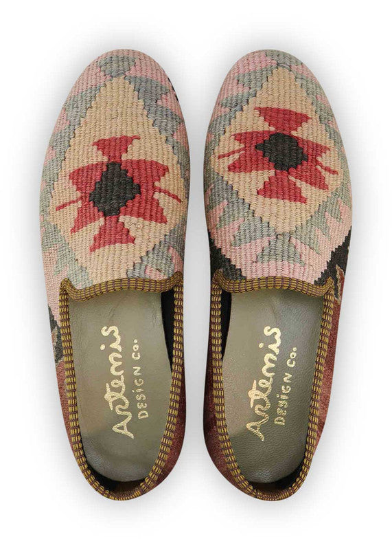 Artemis Design & Co Men's Loafers are the perfect blend of style and versatility. These loafers come in a stunning color combination of black, pink, grey, khaki, red, and brown, allowing you to express your unique sense of fashion. Crafted with premium materials, these loafers offer exceptional comfort and durability. (Front View)