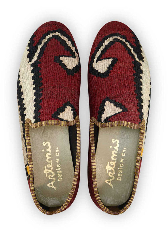 Artemis Design & Co Men's Loafers are a stylish and versatile choice for men, featuring a unique color combination of maroon, grey, black, white, and yellow orange. These loafers are crafted with premium materials, ensuring both comfort and durability.(Front View)