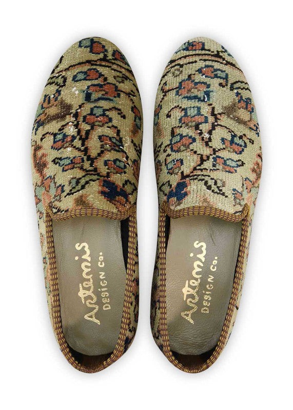 Artemis Design & Co Men's Loafers are a fashionable choice for men who want to add a touch of style to their outfit. These loafers feature a captivating color combination of off white, red, maroon, green, grey, and peach. Made with premium materials, these loafers offer both comfort and durability. (Front View)