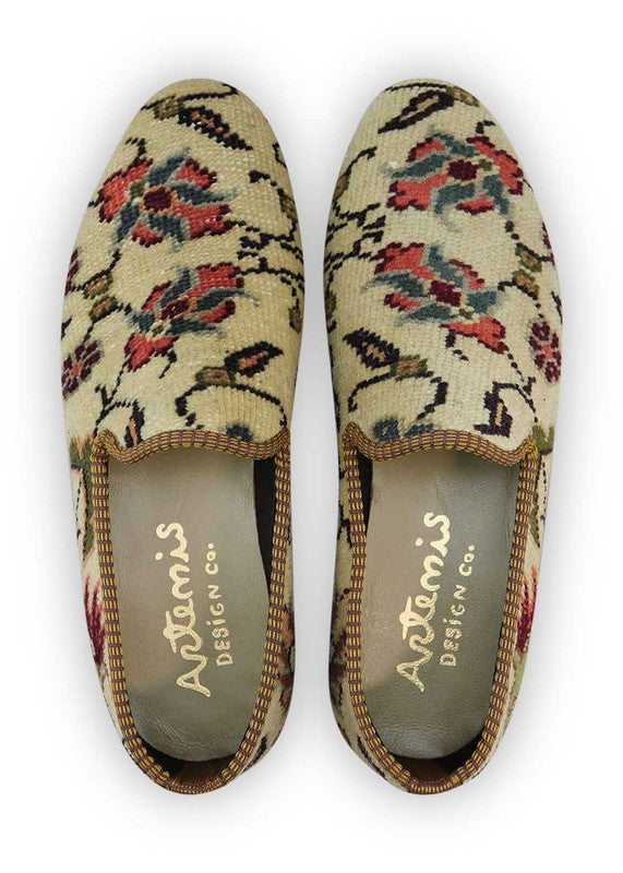 Artemis Design & Co Men's Loafers are a fashionable choice for men who want to add a touch of style to their outfit. These loafers feature a captivating color combination of off white, red, maroon, green, grey, and peach. Made with premium materials, these loafers offer both comfort and durability. (Front View)