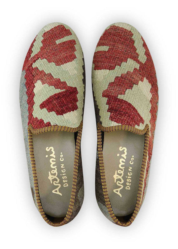 Artemis Design & Co Men's Loafers are a stylish and sophisticated choice for any occasion. With a color combination of red, white, dark grey, grey, and light green, these loafers offer a unique and eye-catching look. Crafted with high-quality materials, these loafers ensure durability and long-lasting wear. (Front View)