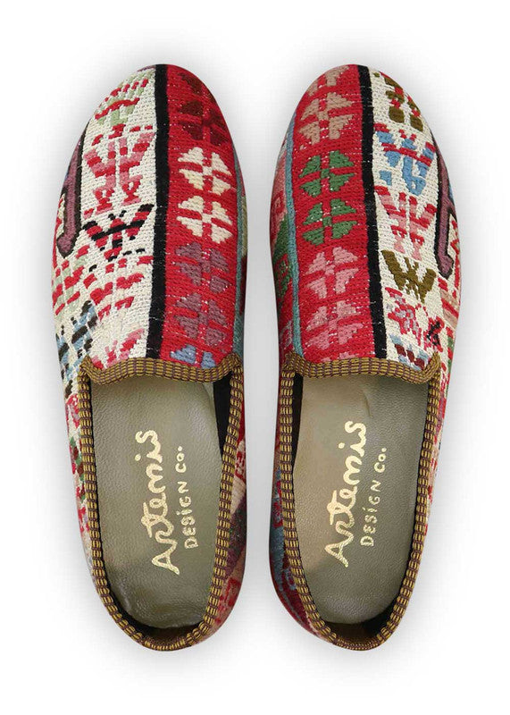 The Artemis Men's Loafers exude a captivating blend of colors, featuring white, red, blue, peach, green, and sky blue. These loafers seamlessly blend the classic appeal of white and blue with the boldness of red, complemented by the softness of peach and green, set against the calming backdrop of sky blue. (Front View)