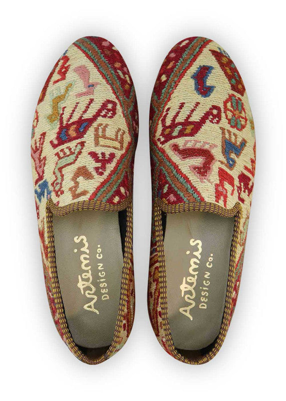 The Artemis Men's Loafers exude a captivating blend of colors, featuring white, red, blue, peach, green, and sky blue. These loafers seamlessly blend the classic appeal of white and blue with the boldness of red, complemented by the softness of peach and green, set against the calming backdrop of sky blue. (Front View)