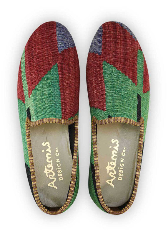 The Artemis Men's Loafers showcase a vibrant mix of colors, featuring blue, red, green, and black. These loafers seamlessly blend the calming tones of blue with the boldness of red and the freshness of green, complemented by the classic appeal of black. The result is a harmonious and dynamic color combination that exudes both confidence and modern flair. (Front View)